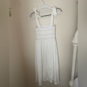 White midi dress with adjustable tie straps.